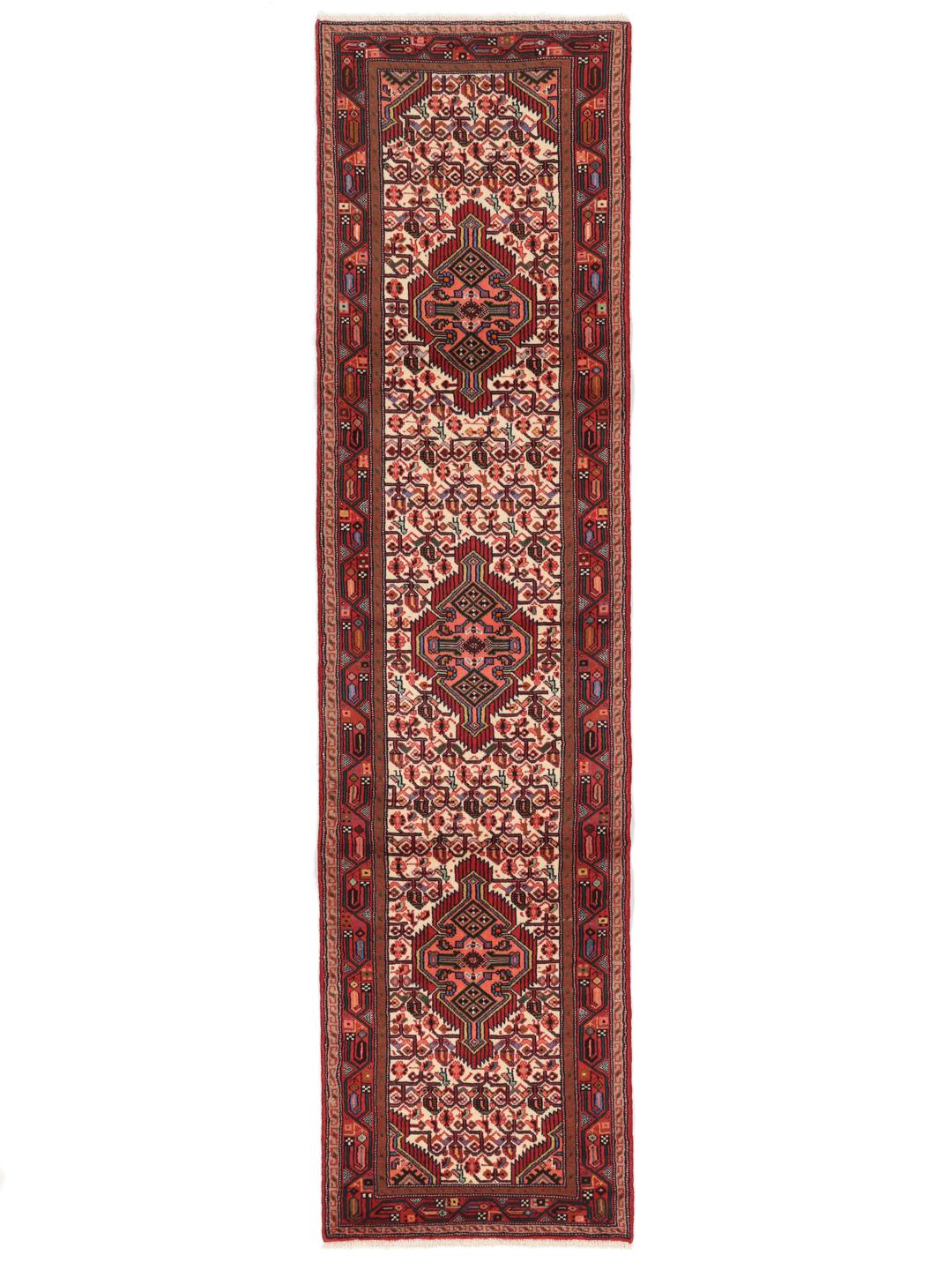 Hand-knotted red runner rug from the Middle East