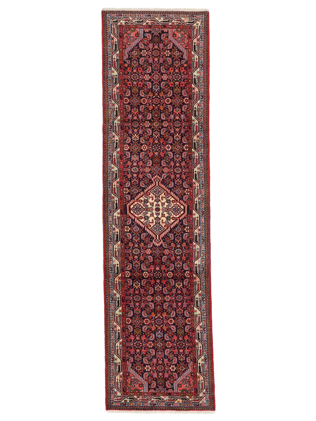 Hand-knotted Asadabad runner with intricate geometric patterns in dark red and blue tones