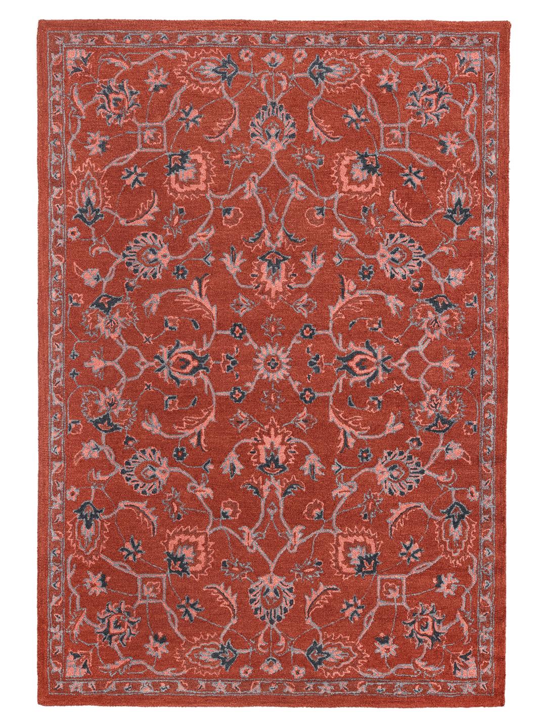 Rood en blauw wollen tapijt met een bloemenpatroon
