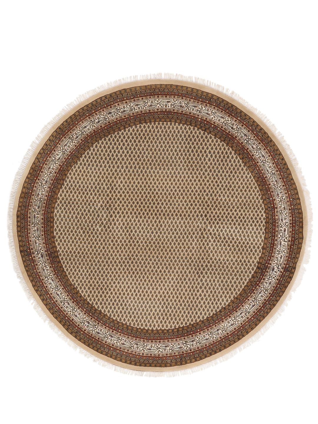 Un tapis rond en laine noué à la main Mir Indo beige avec un motif floral détaillé