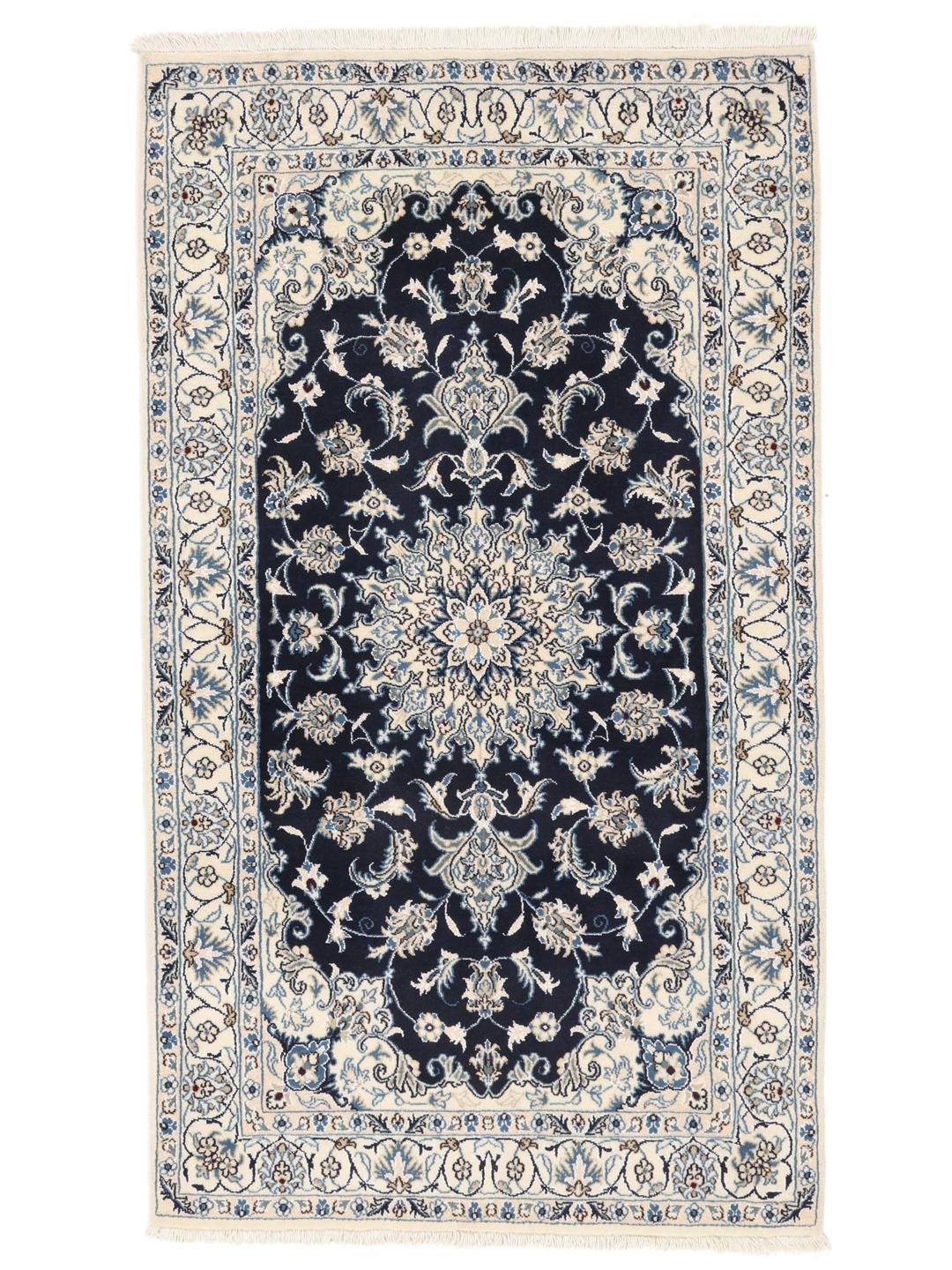 A hand-knotted Nain rug from the Middle East in dark-blue and cream tones.