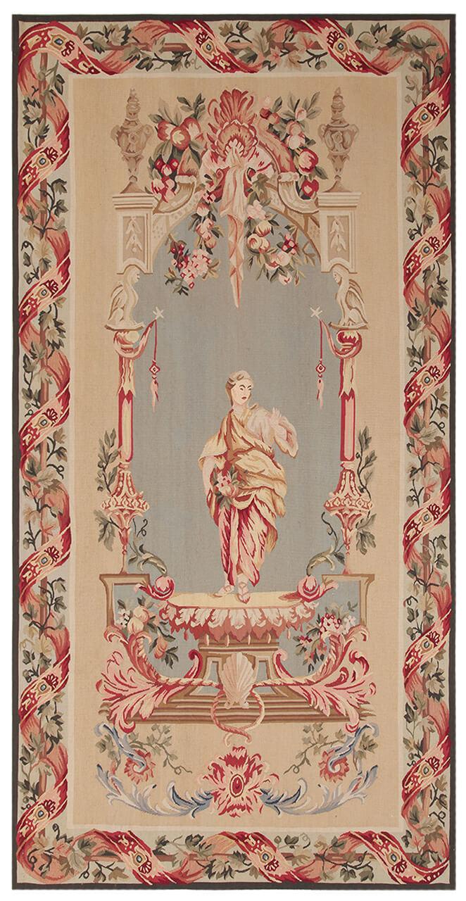 Håndvævet tæppe i Aubusson-stil med blomstermotiver og en central figur i beige og rød