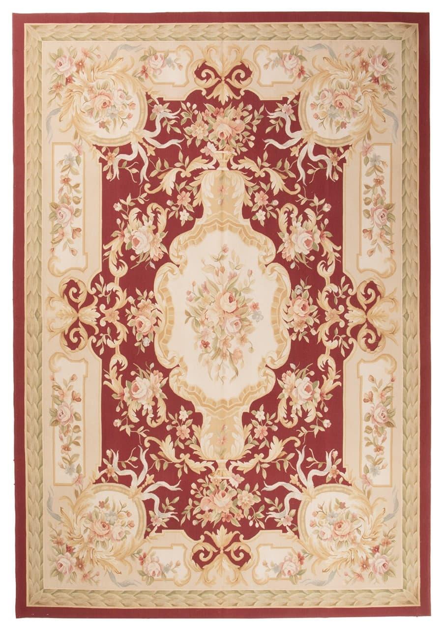 Hand-woven floral rug with a red field and decorative border from China