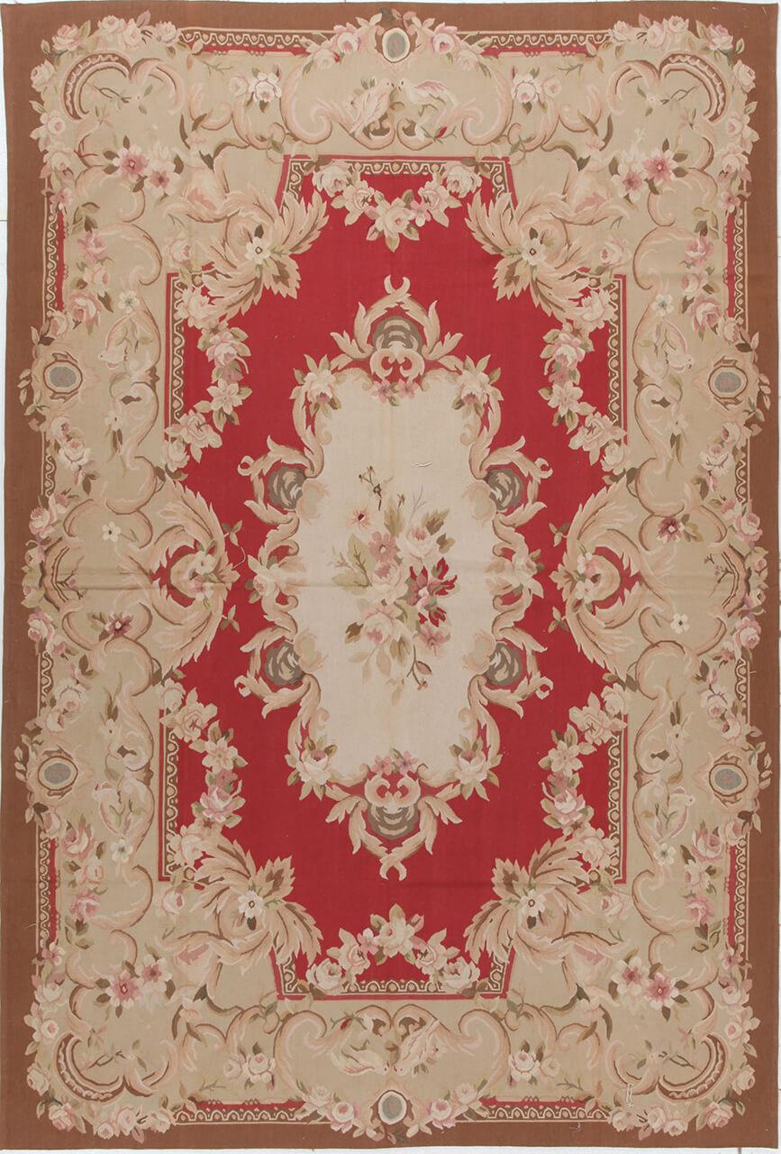 Håndvævet blomstret kilim-tæppe fra Kina i røde og beige toner