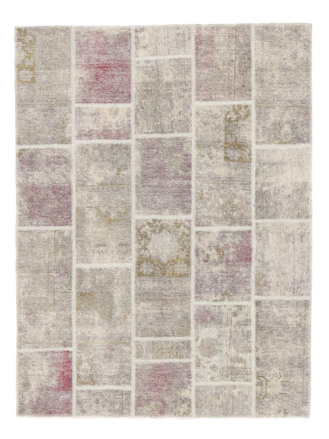 A rectangular handmade patchwork rug from the Middle East featuring a multicolor palette.