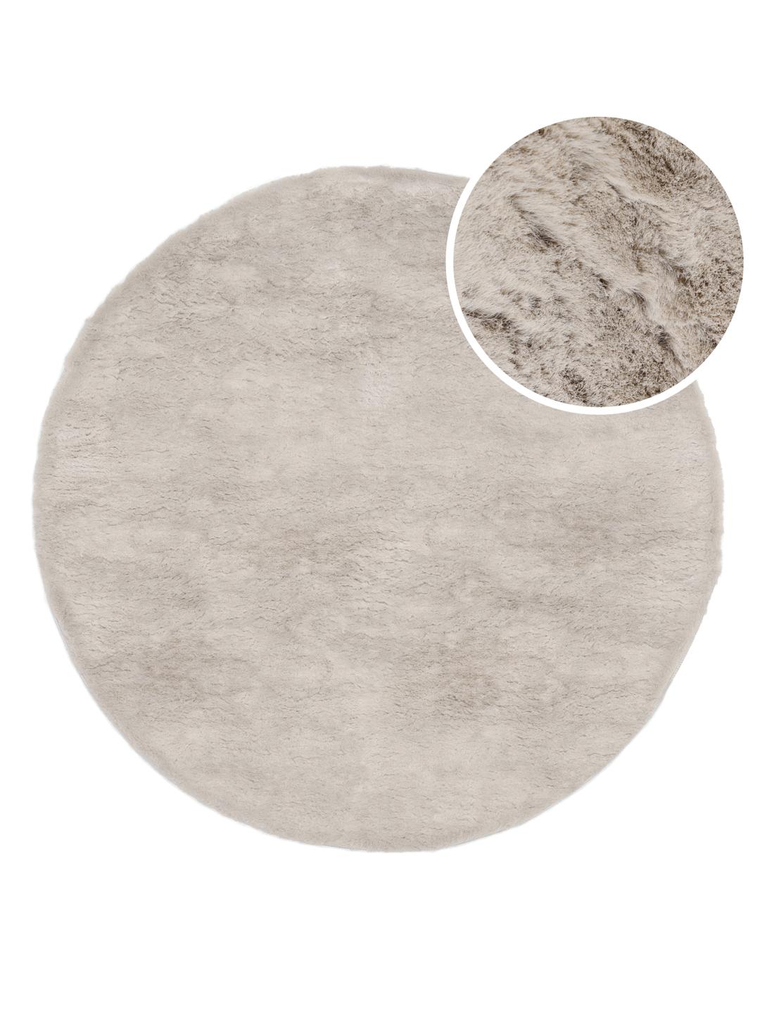 Rundt beige tæppe med en blød plystekstur