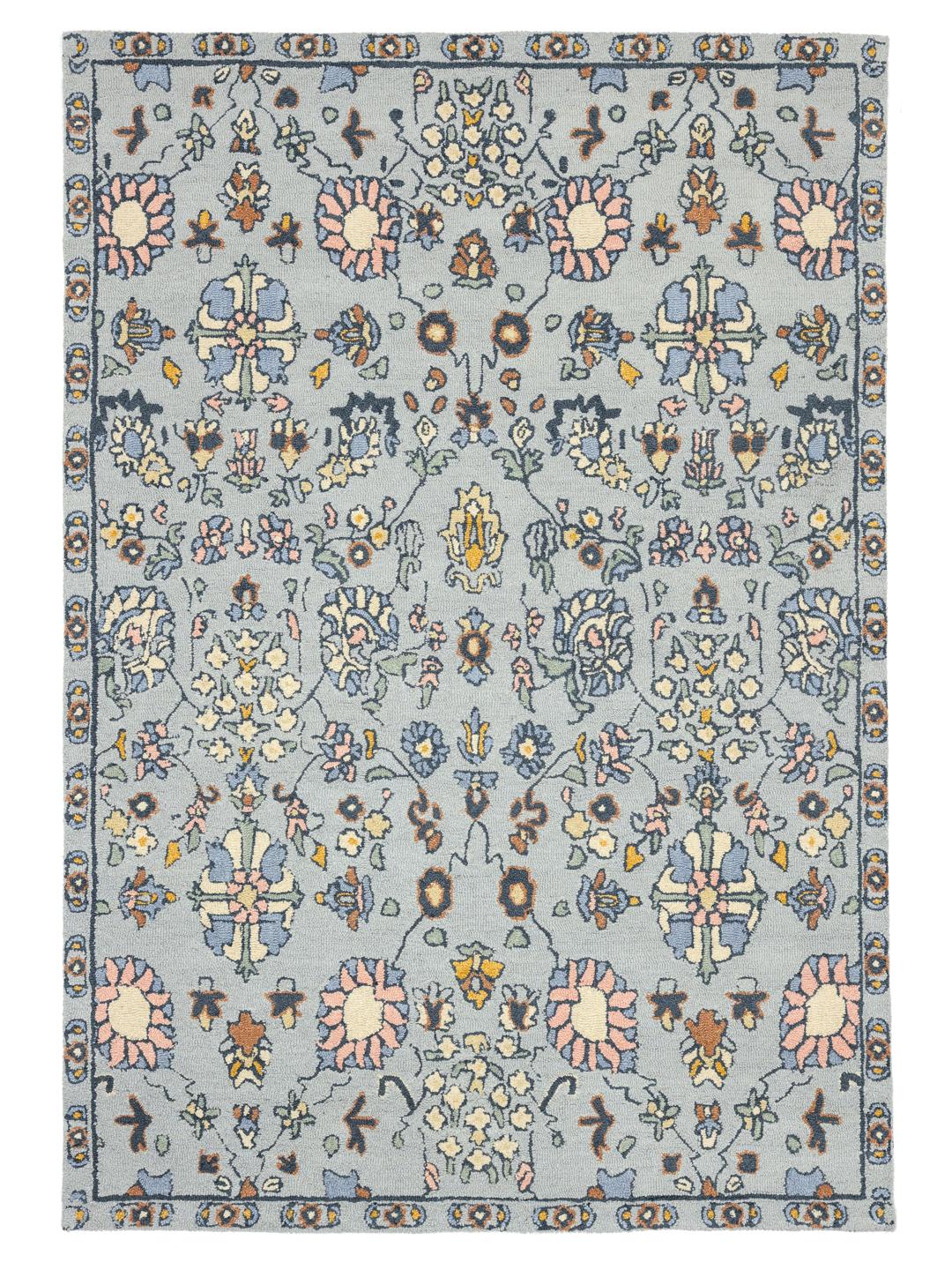 Blauw tapijt met een traditioneel bloemmotief en een zachte wollen textuur