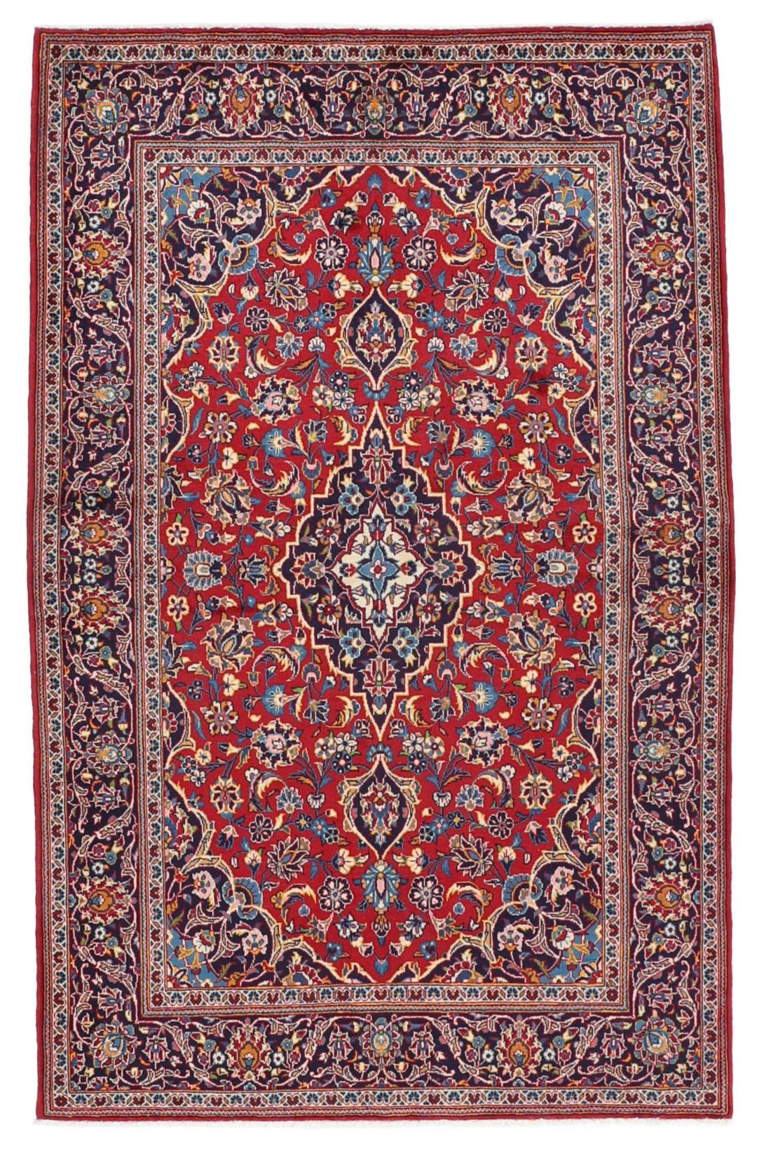 Handgeknoopt Kashan-tapijt met een centraal medaillon in rode en blauwe tinten