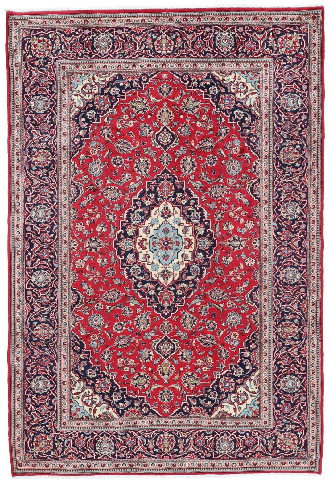 Handgeknoopt Keshan-tapijt uit het Midden-Oosten met een rood veld en blauw medaillon