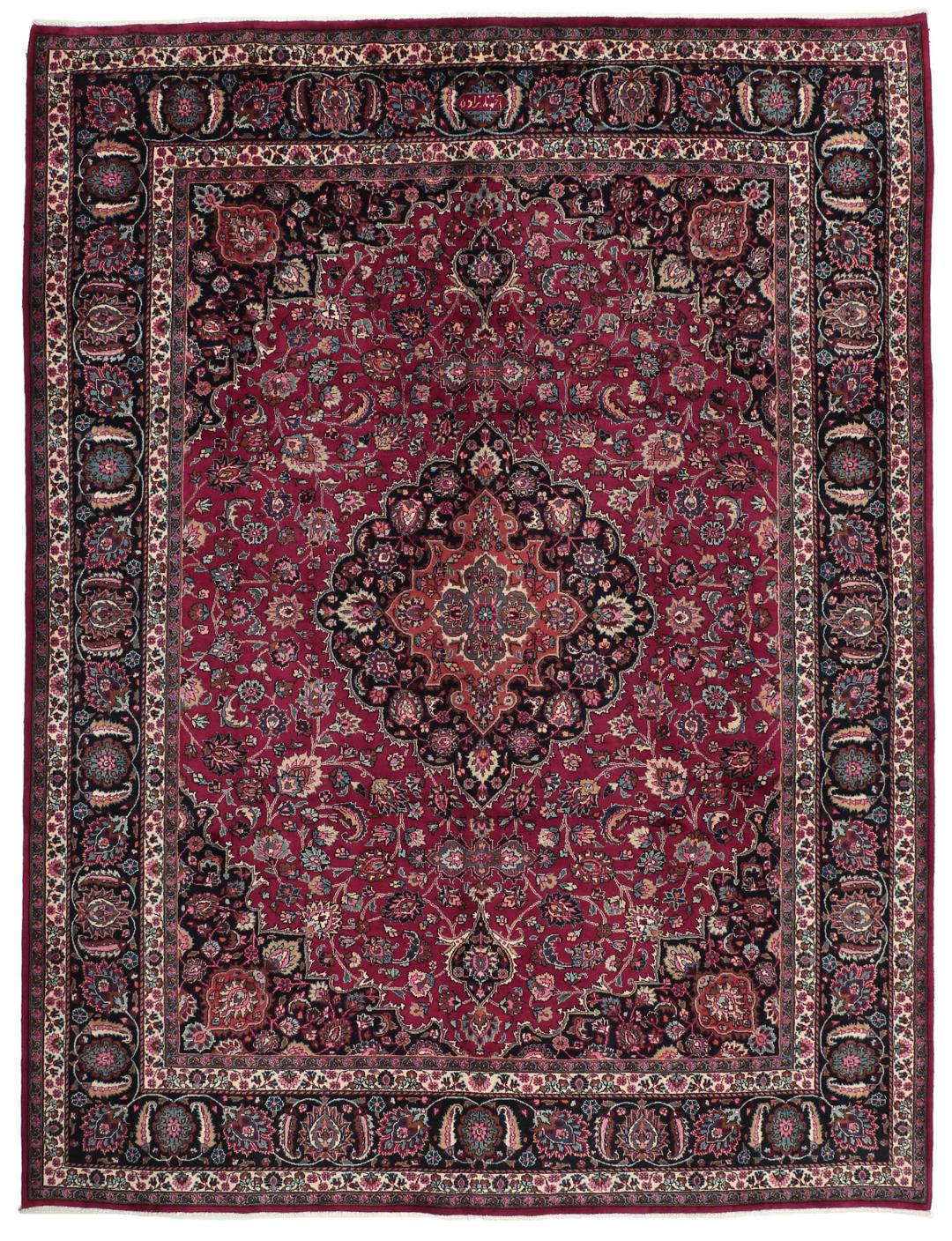 Hand-knotted Mashad rug from the Middle East featuring a dark-red field and floral patterns