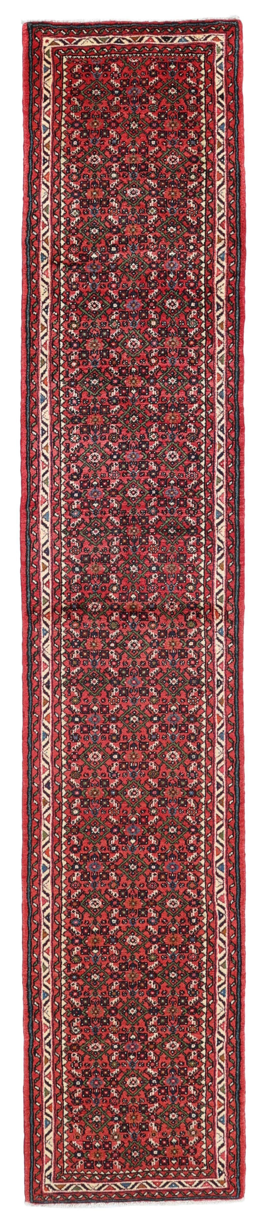 Hand-knotted Hosseinabad runner from the Middle East in shades of red