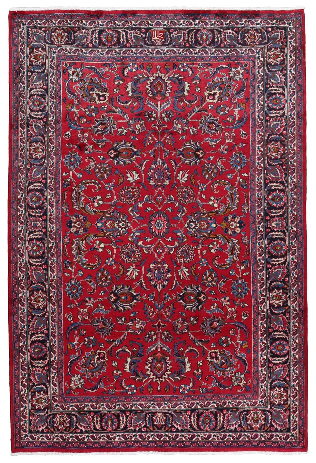 Hand-knotted Mashad rug from the Middle East in red with floral patterns.