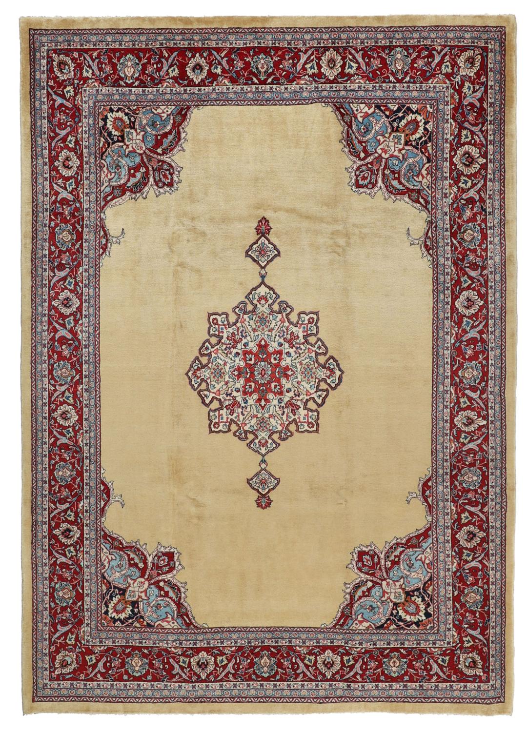 A hand-knotted Sarough rug from the Middle East with a beige field and red accents.