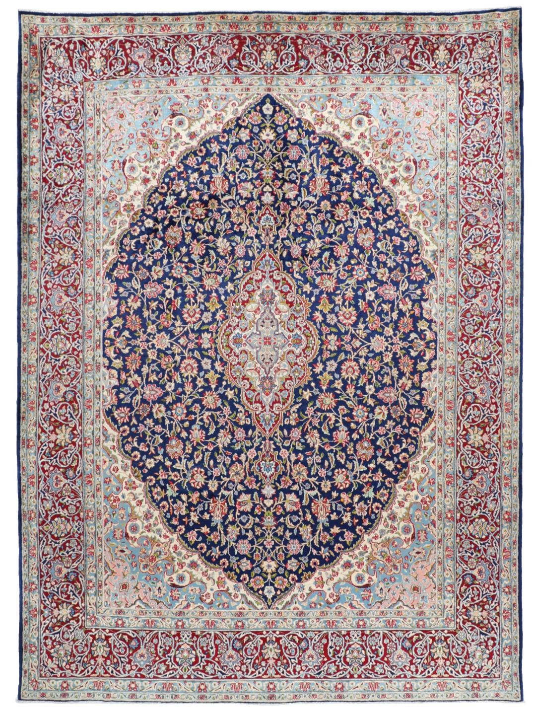 Hand-knotted Kerman rug with a blue and red floral medallion design from the Middle East.