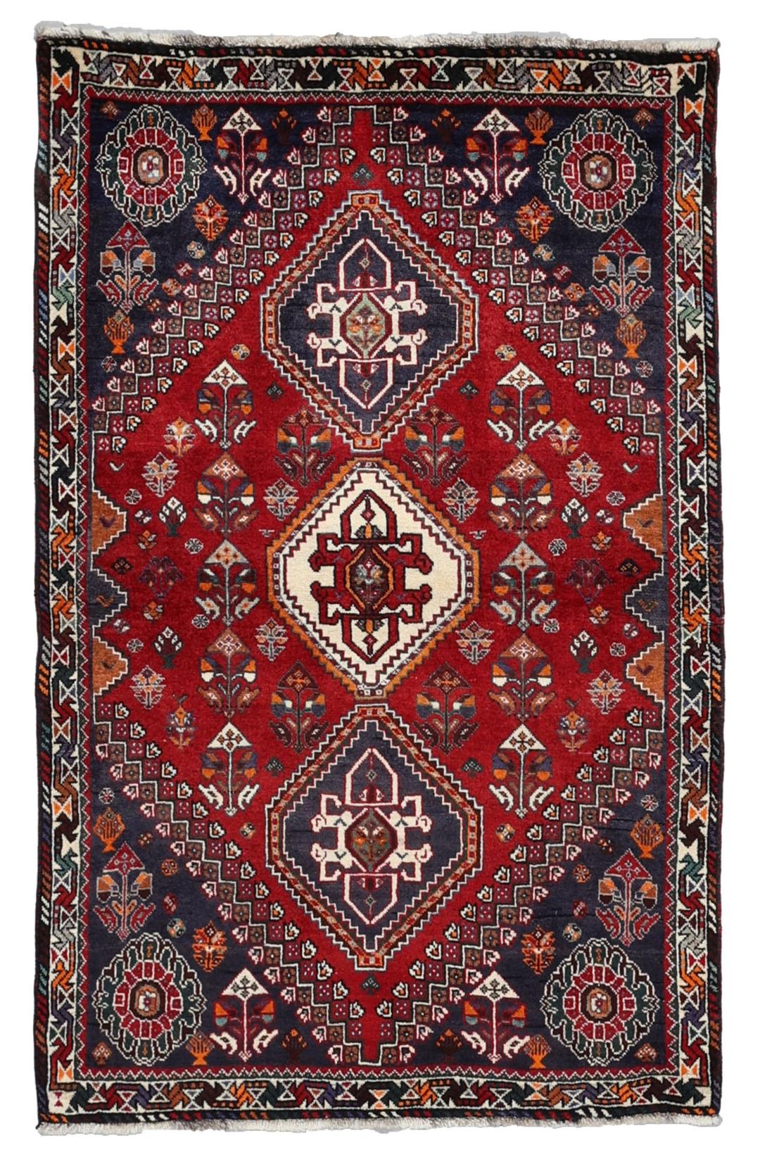 Handmade Shiraz rug from the Middle East featuring a vibrant dark-red and blue geometric design.