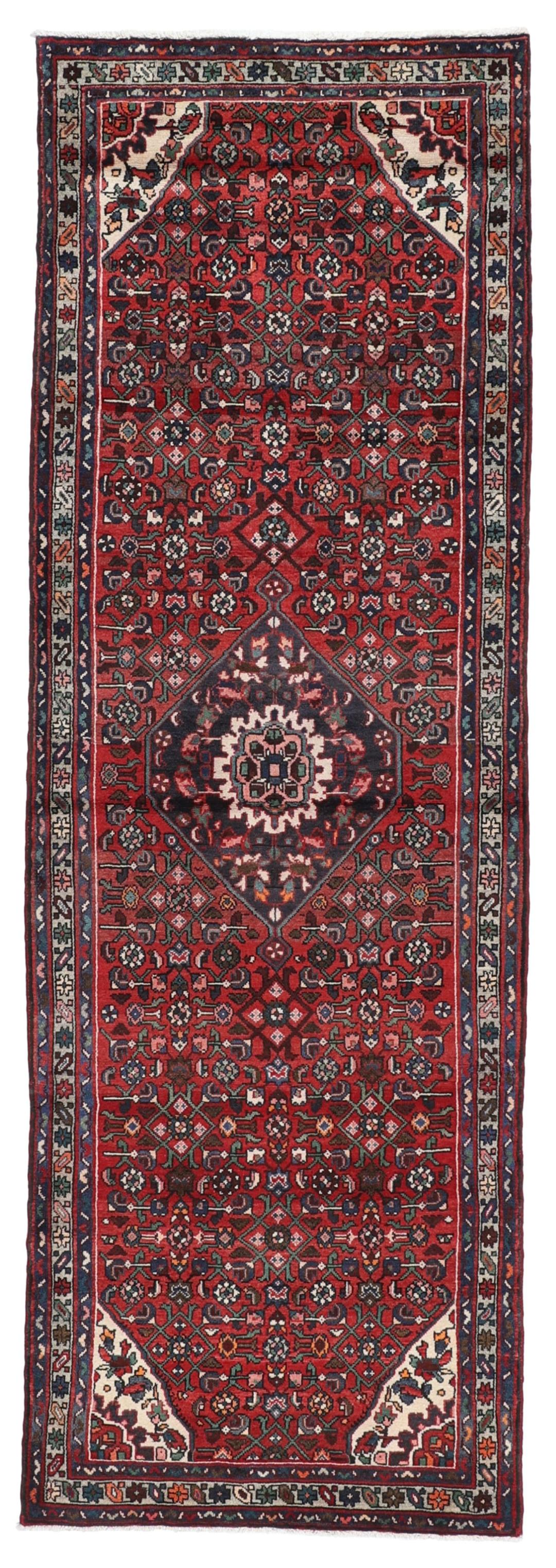 Hand-knotted Hosseinabad runner in red from the Middle East