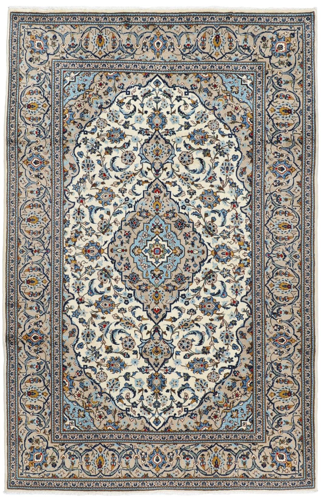A hand-knotted Keshan rug from the Middle East featuring a blue and beige floral medallion pattern.