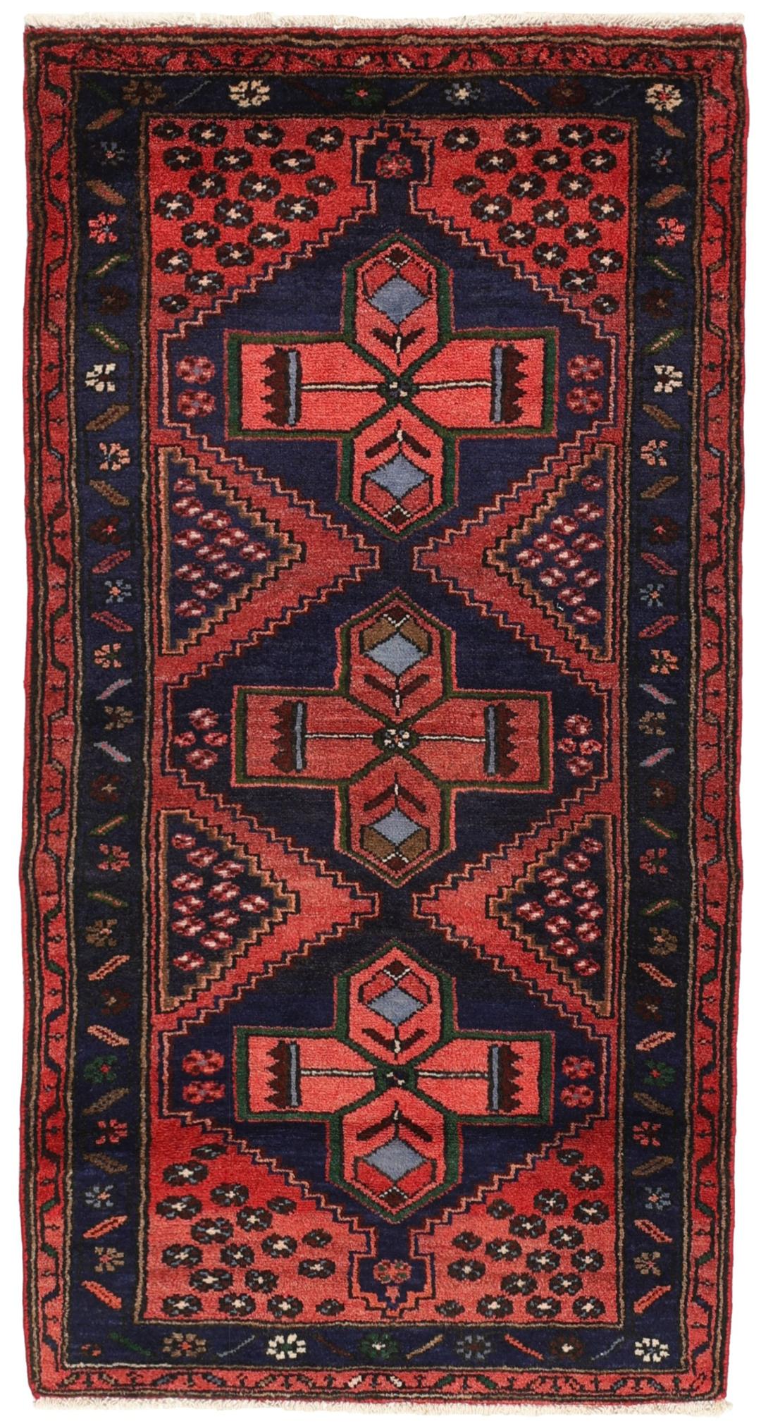 A hand-knotted Hamadan rug from the Middle East featuring a dark-blue and red geometric pattern.
