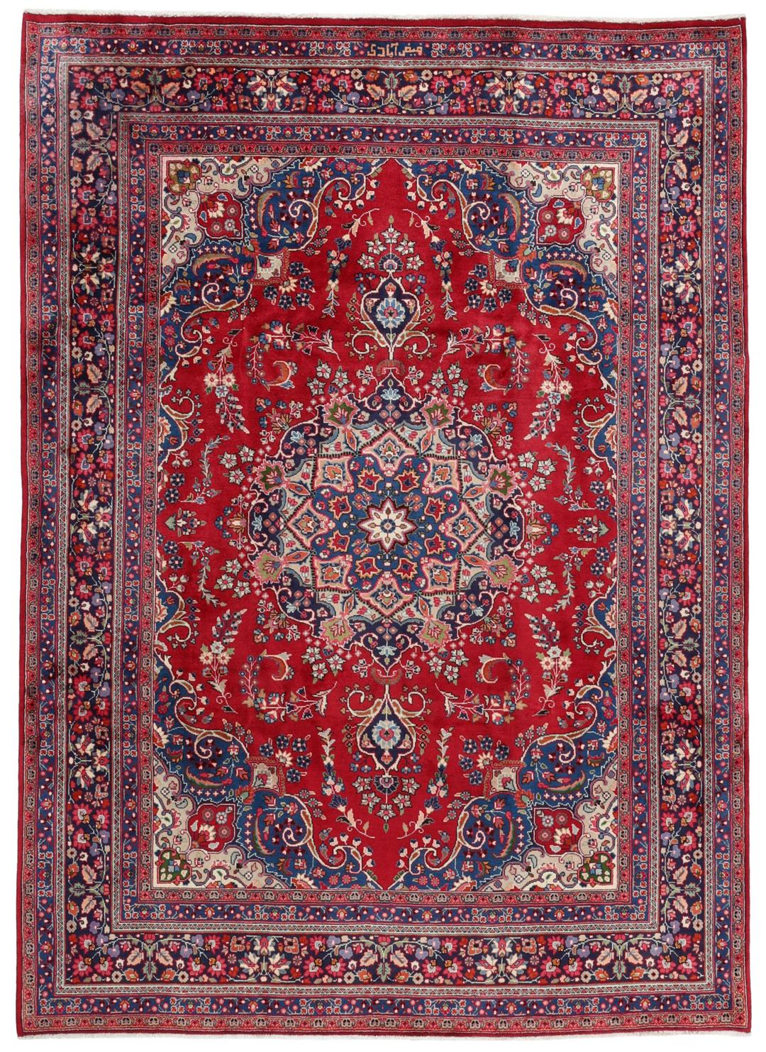Hand-knotted Mashad rug from the Middle East with a red and blue floral pattern.