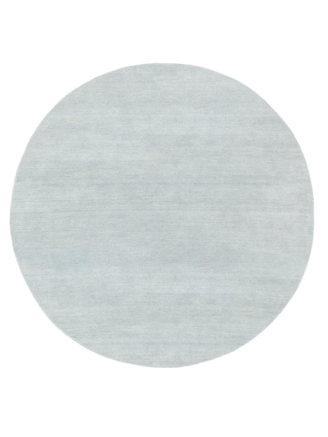Rond stoffig blauw handloom vloerkleed gemaakt van wol
