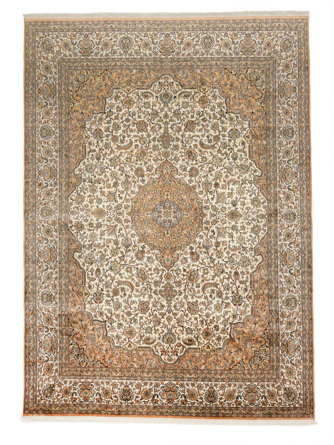 A hand-knotted Indian Kashmir silk rug with an intricate beige and floral pattern.