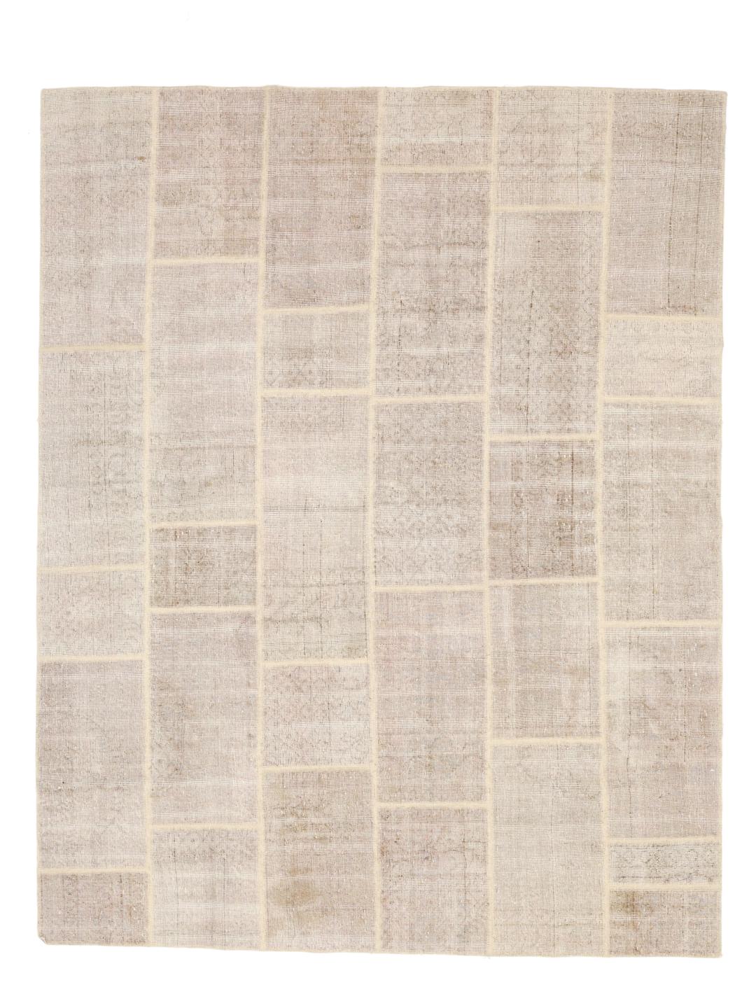 Et neutralt beige patchwork uldtæppe med et rektangulært gittermønster fra Mellemøsten.