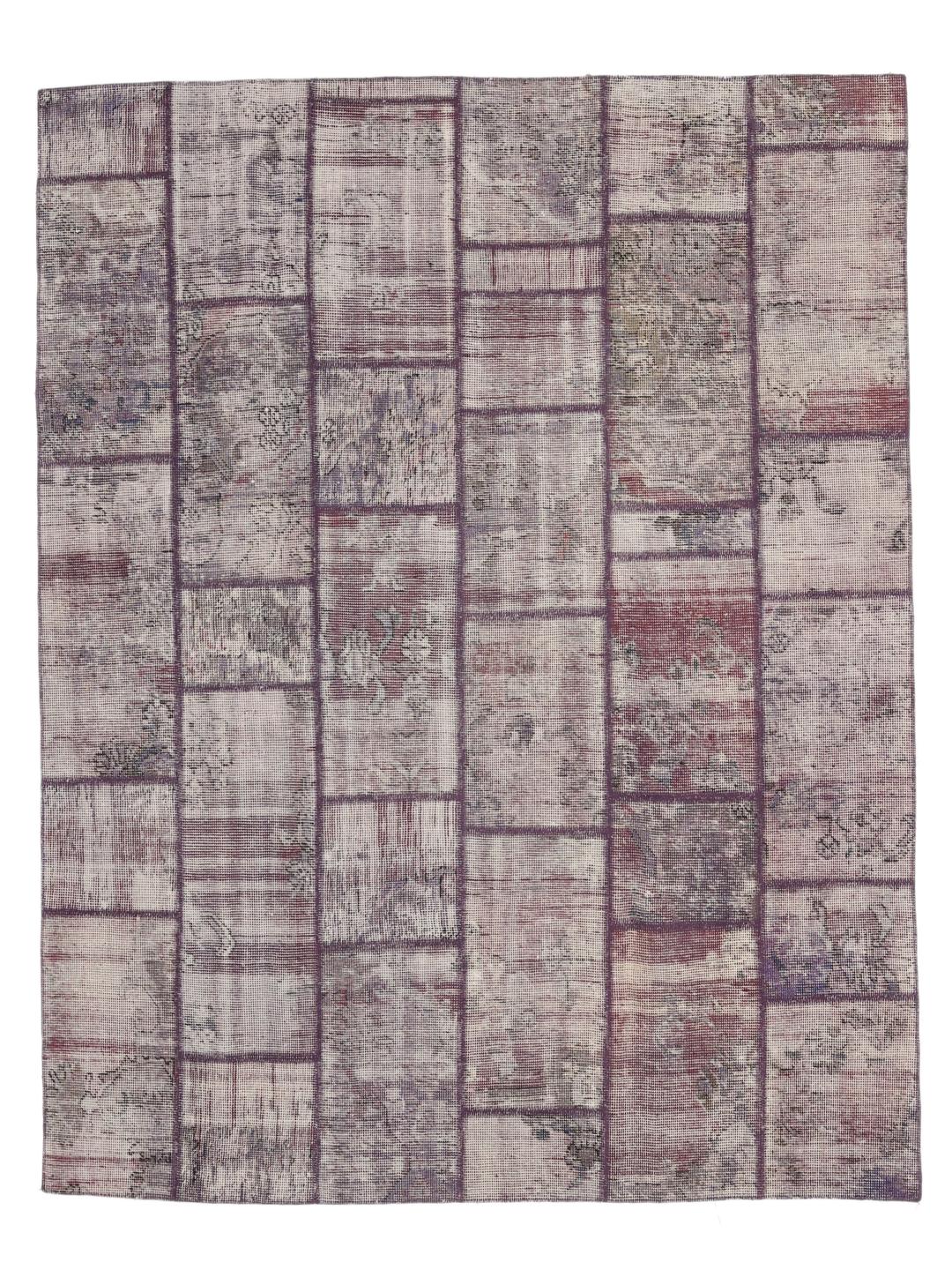 A unique, one-of-a-kind patchwork rug from the Middle East featuring a multicolor palette.