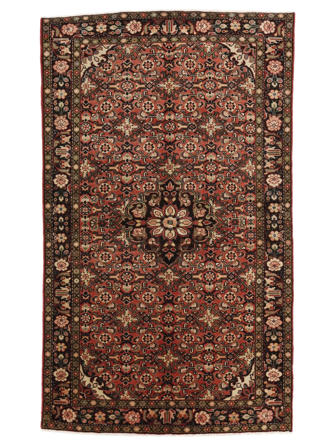 A hand-knotted Hosseinabad rug from the Middle East featuring a red and dark-toned floral design