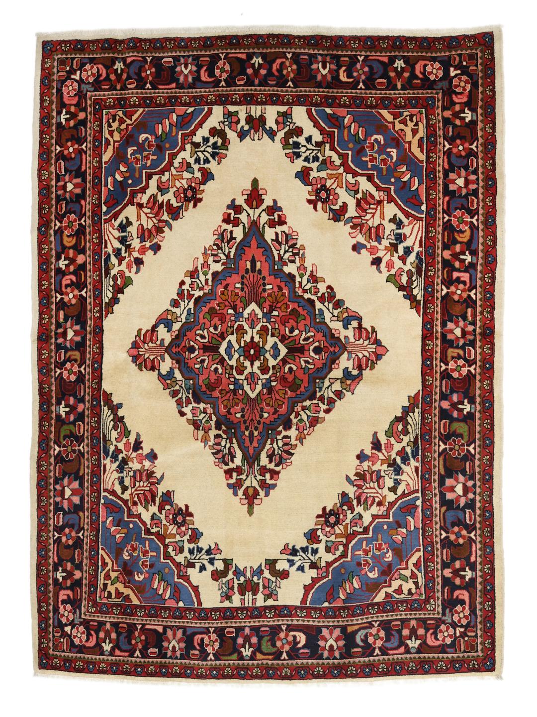 Handgemaakt Lillian-tapijt met een centraal medaillon en bloemmotieven in beige, blauwe en rode tinten