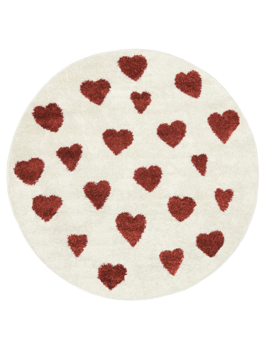 Tapis rond avec un motif de cœurs rouges sur fond blanc cassé