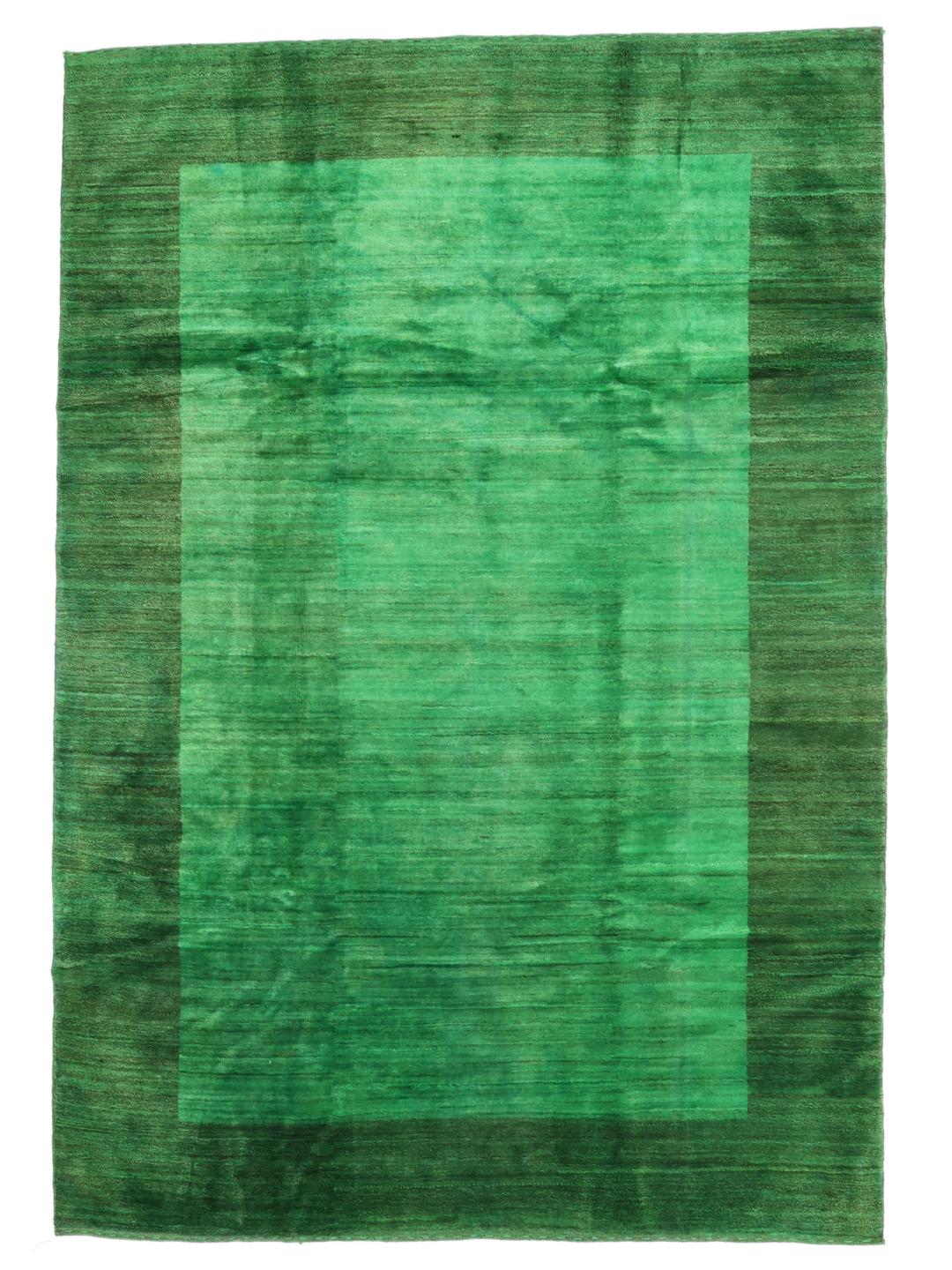 Hand-knotted Gabbeh rug from the Middle East in a deep green shade.