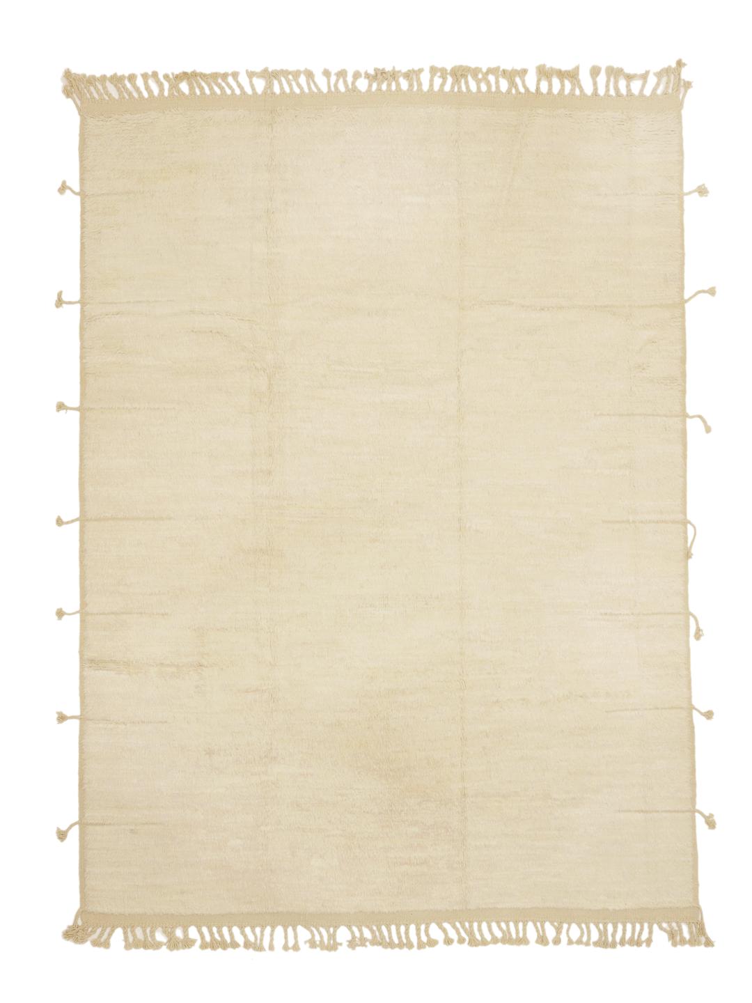 A neutral, hand-knotted beige rug from Afghanistan with an organic, minimalist design.
