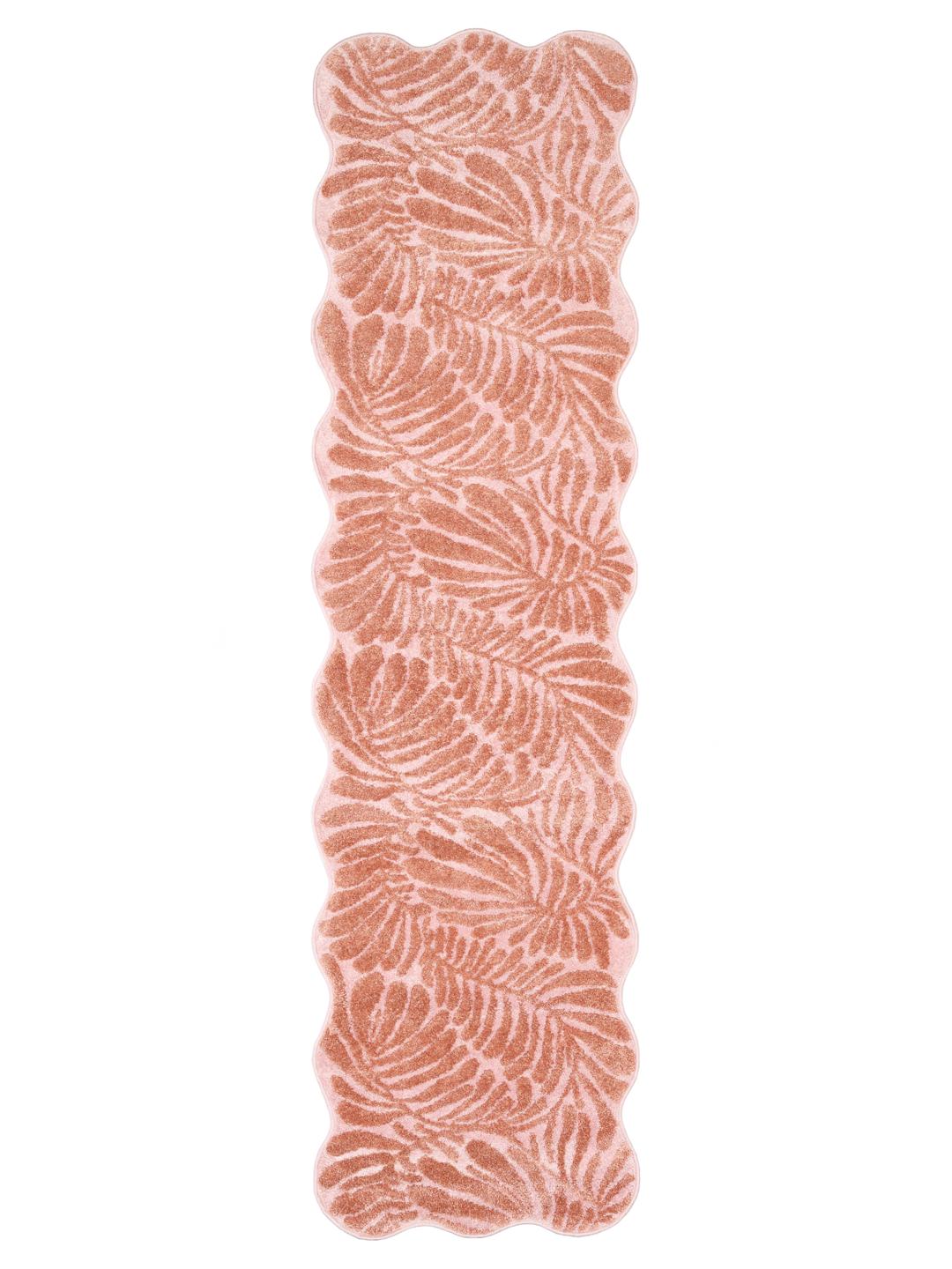 Vloerkleed in donkerroze en roze met een bladmotief en geschulpte rand