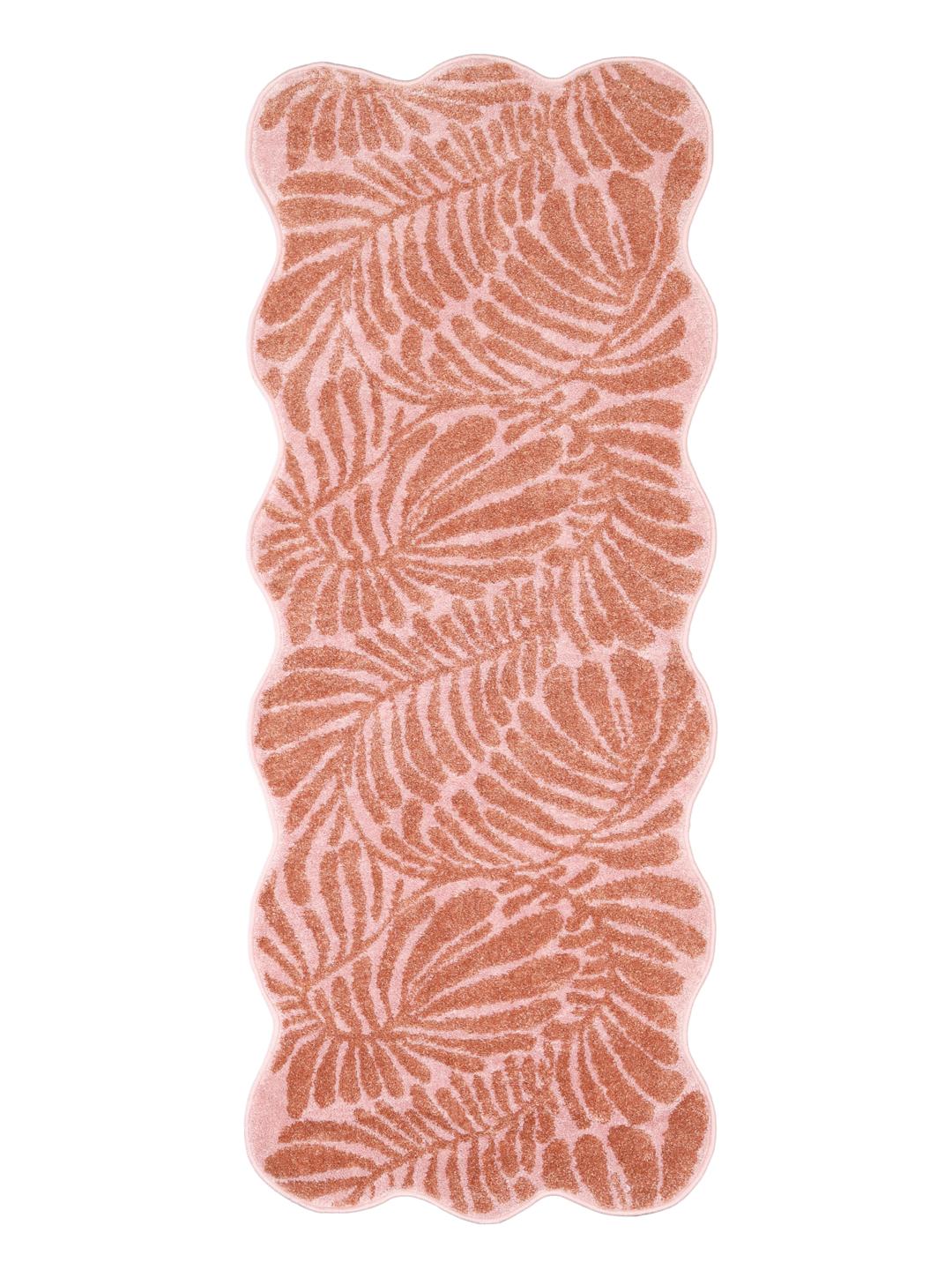 Vloerkleed in donkerroze en roze met een bladmotief en geschulpte rand