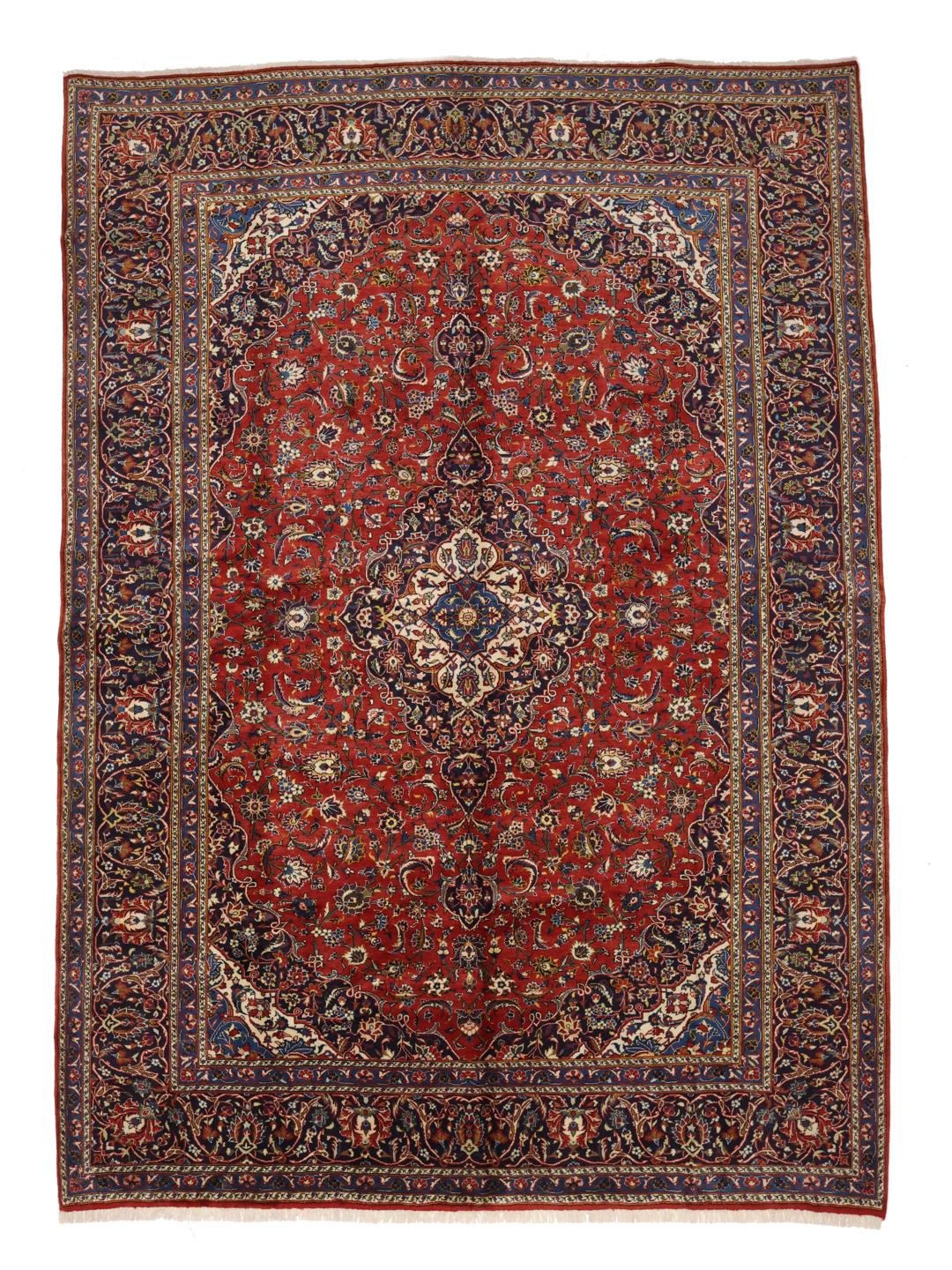 Hand-knotted Keshan rug from the Middle East in red and deep blue tones.