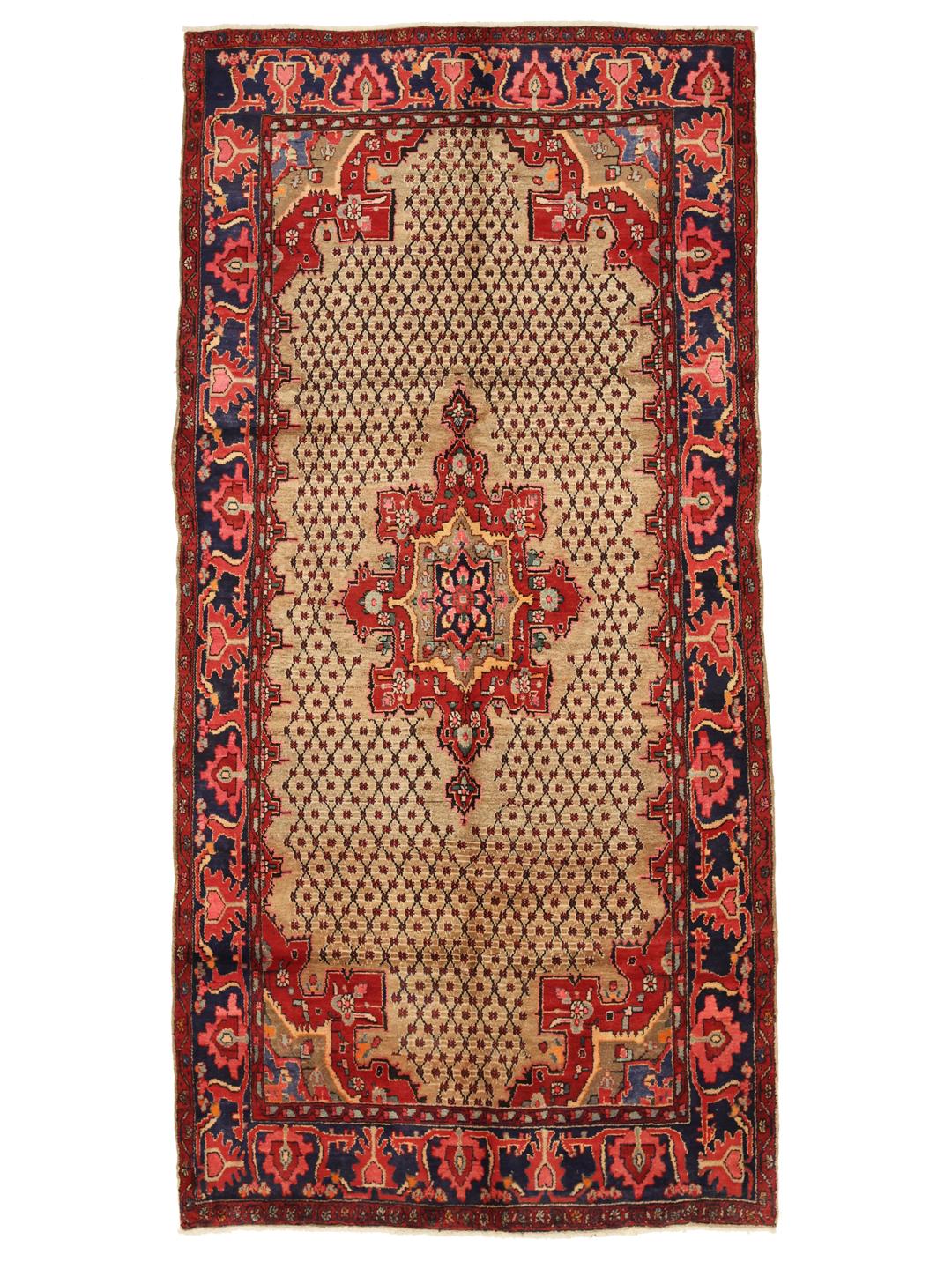 A hand-knotted Koliai rug from the Middle East with a multicolor geometric design.