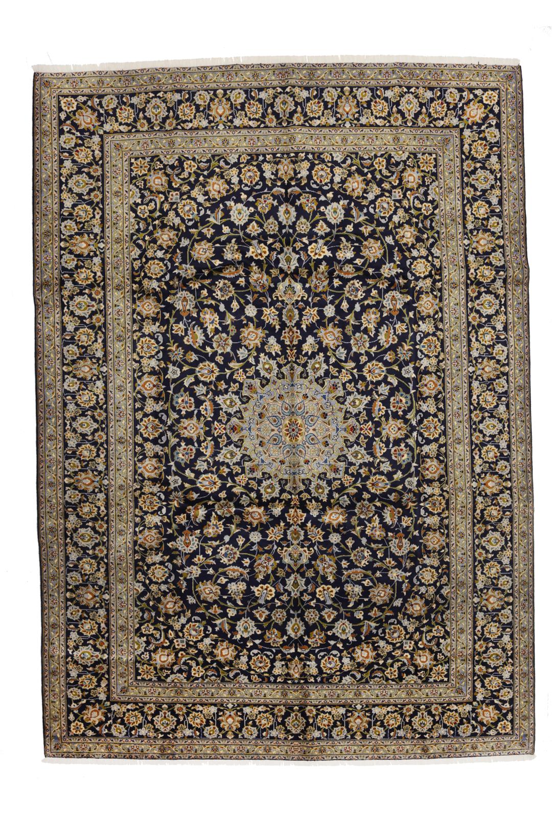 Hand-knotted Keshan rug from the Middle East in dark blue with intricate floral patterns