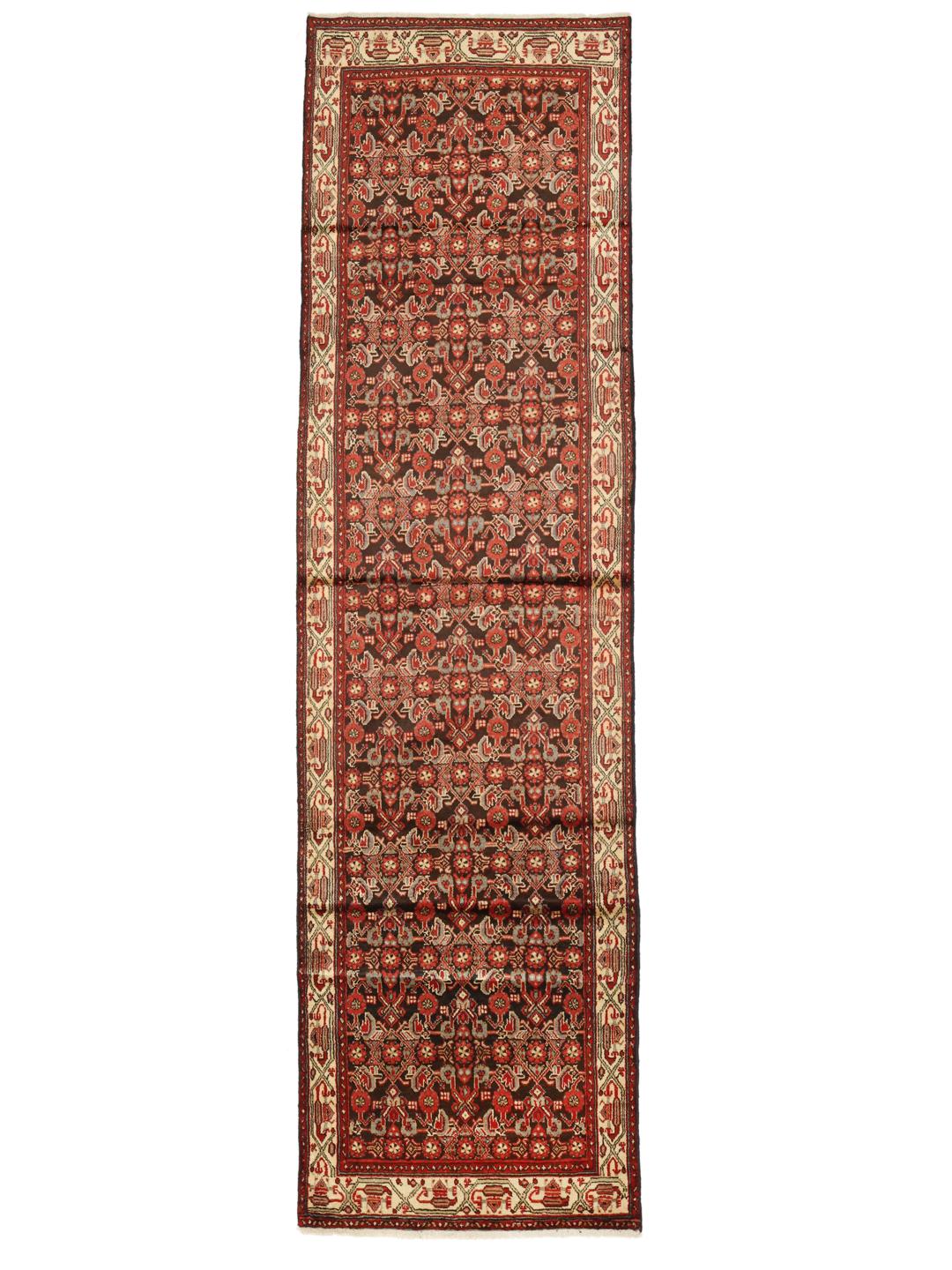 A long, hand-knotted Hamadan runner with a dark-red and cream floral pattern.