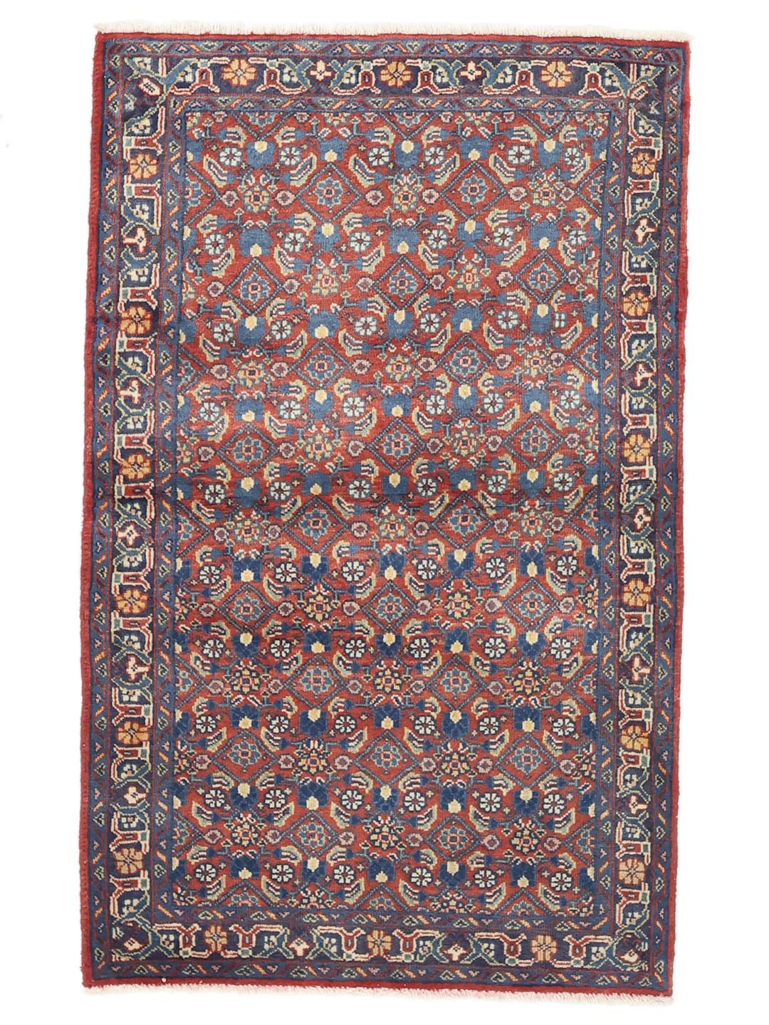 A hand-knotted Hamadan rug from the Middle East featuring blue and red tones.