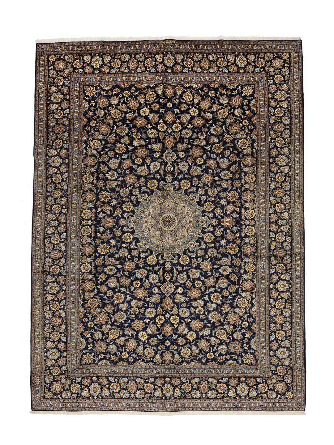 Hand-knotted Keshan rug from the Middle East in dark-blue with a floral medallion pattern.