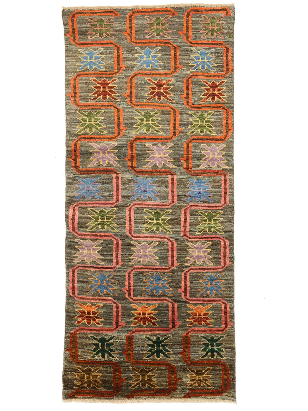 Hand-knotted Middle Eastern runner with a colourful pattern on a grey background