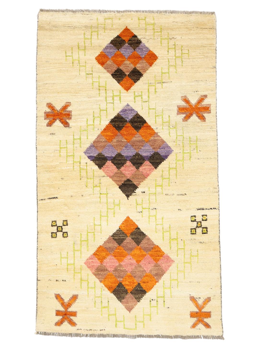 Hand-knotted Afghan rug with colourful geometric diamonds on a beige background.
