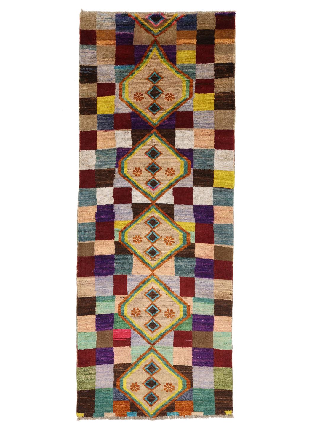 Hand-knotted Afghan runner with vibrant geometric diamond motifs and multicolor squares.