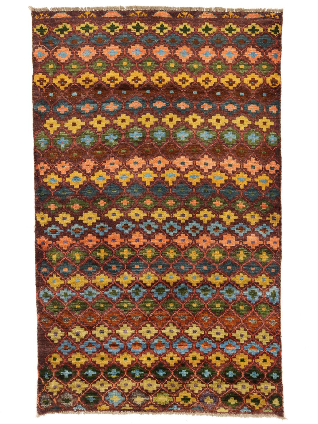A vibrant, hand-knotted Berber rug from Afghanistan with a geometric multicolored design.