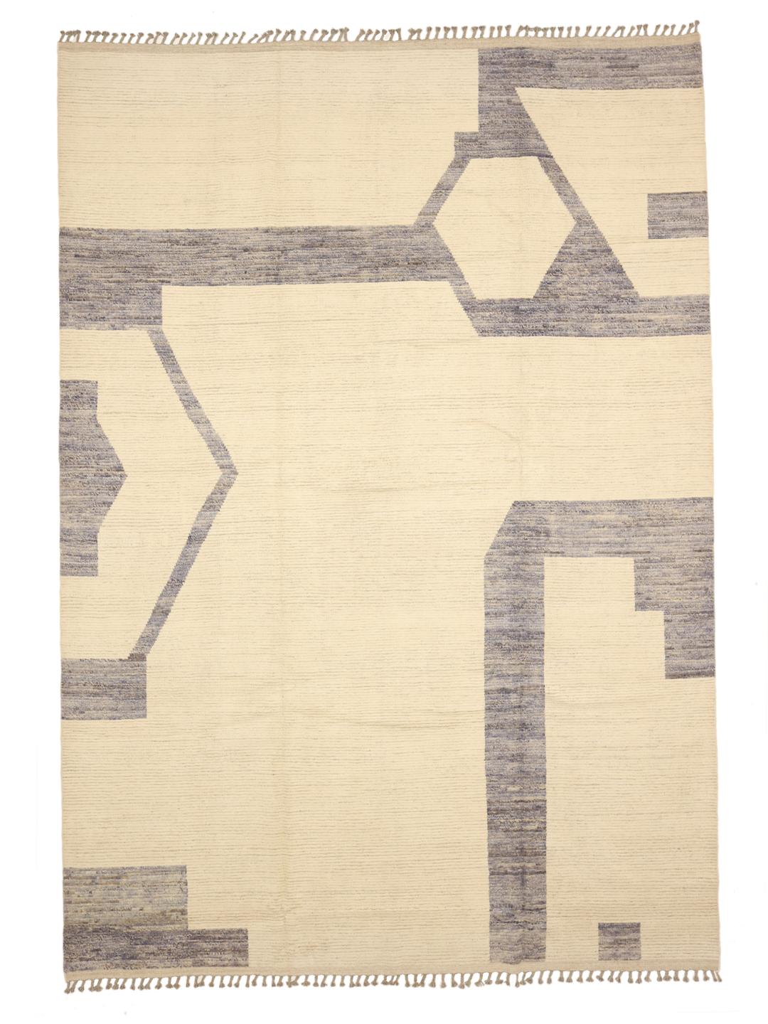A large hand-knotted Afghan rug featuring a geometric pattern in beige and grey