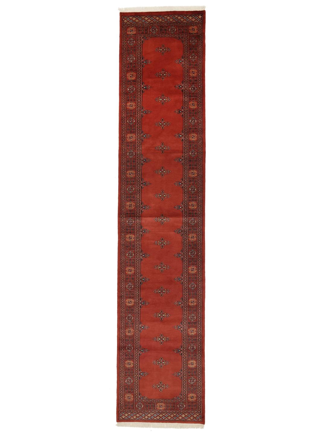 Hand-knotted Pakistan Bokhara runner in deep red with traditional motifs.