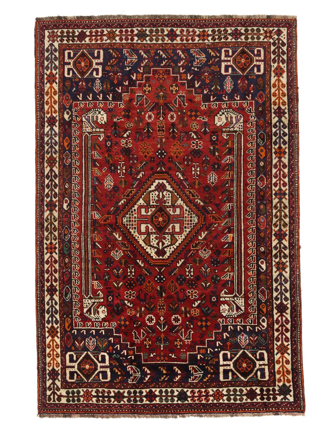 Hand-knotted Shiraz rug with geometric patterns in deep red and blue tones from the Middle East