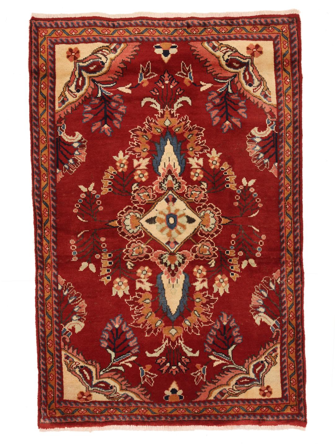 Een handgeknoopt Lillian-tapijt uit het Midden-Oosten in rood met bloemmotieven.
