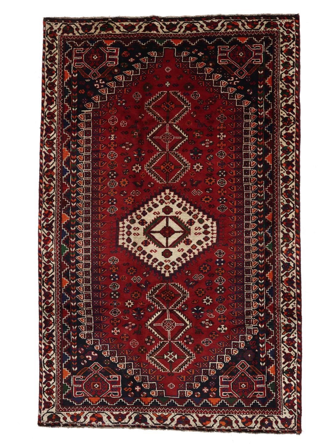 Hand-knotted Shiraz rug from the Middle East in dark red and dark blue