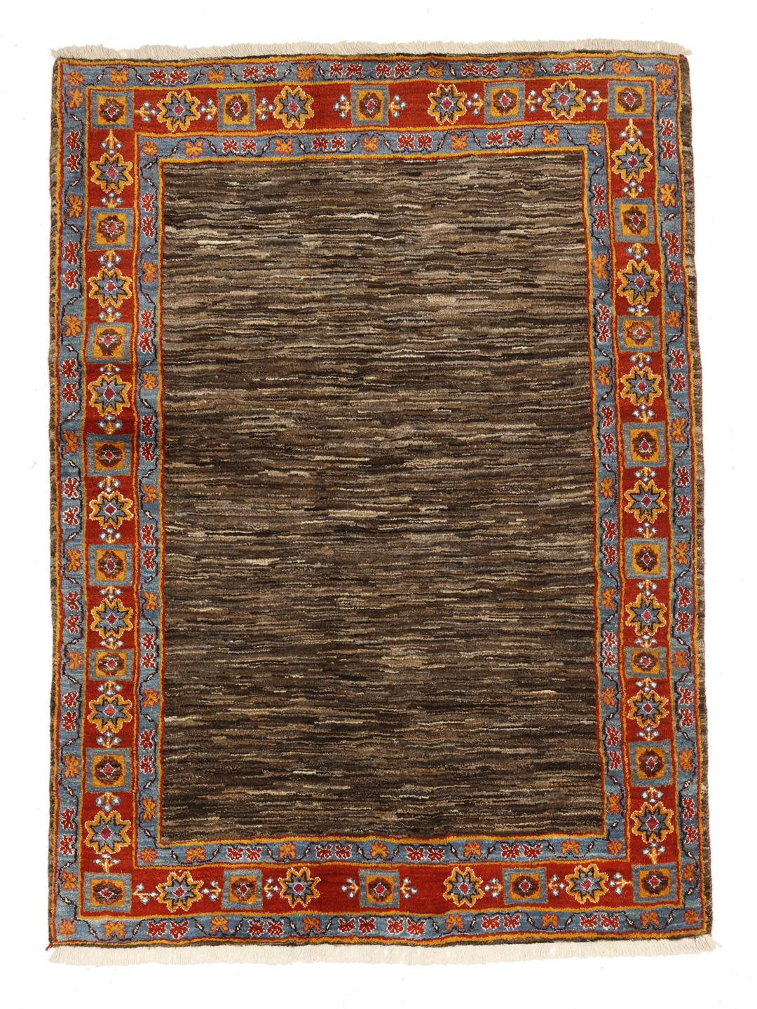 A rectangular Gabbeh rug from the Middle East with a brown field and vibrant border.